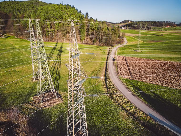 Transmission towers over rural farmland